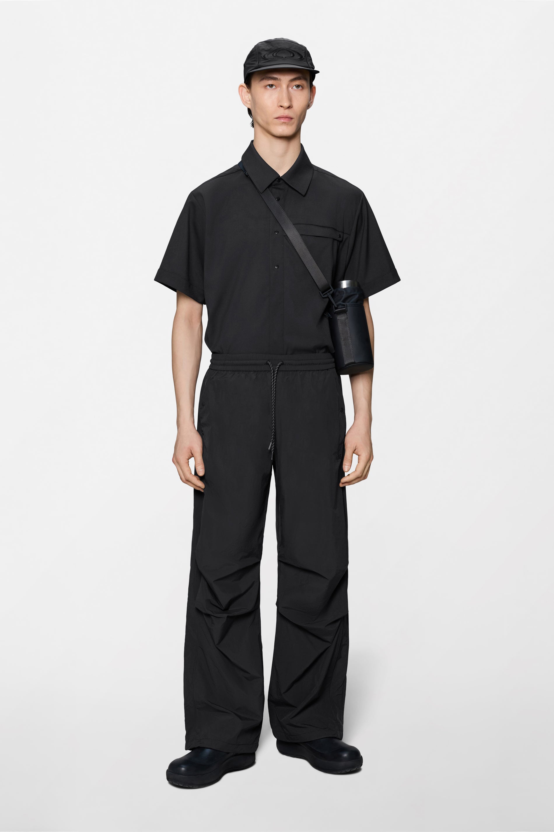 RAINS Cooldown Track Pants Black Pants
